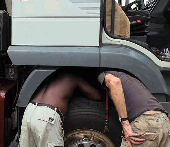 Lawrence and Jaku are fixing a blocked air filter