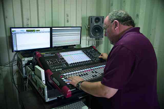 Derek adjusting the sound in the container.