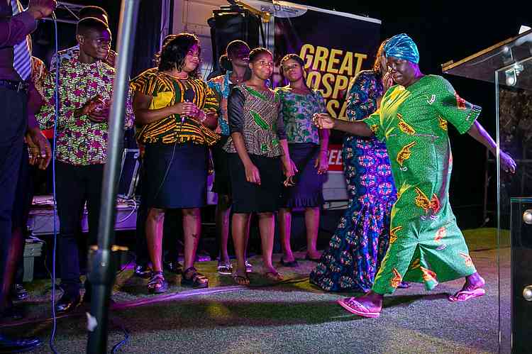 This mama had knee pain for 5 years but it left after the prayer, and she demonstrated how she can walk without pain. 