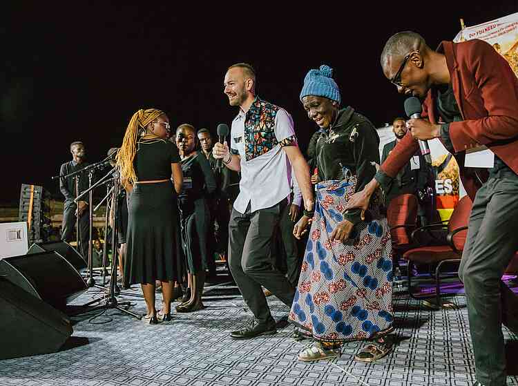 Catherine Madinga had a stroke three months previously, leaving her legs paralyzed. The crowd erupted as she walked freely on the stage, all stroke symptoms gone!