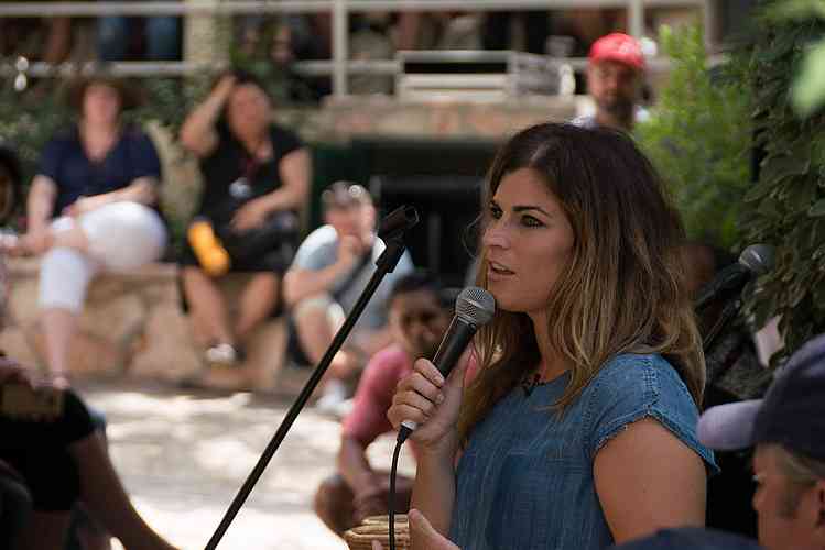Jenny Kutz preaching during supper