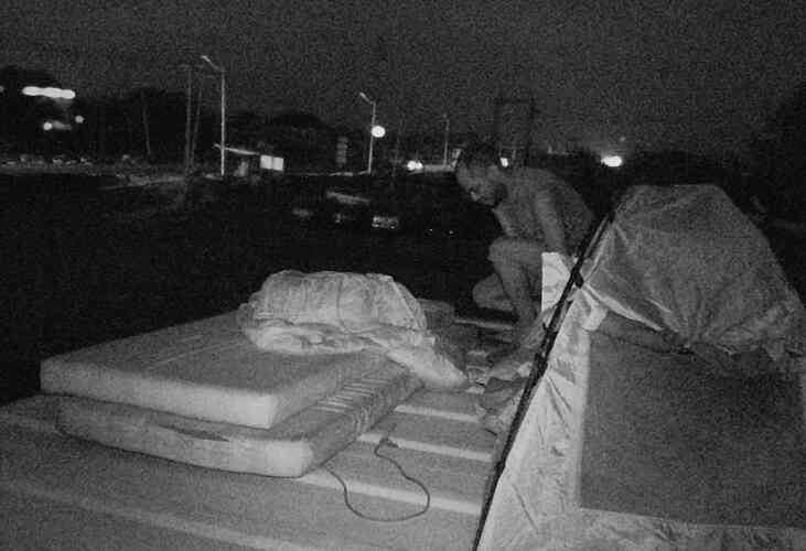 Every night, the crew set up their tents on top of the containers.