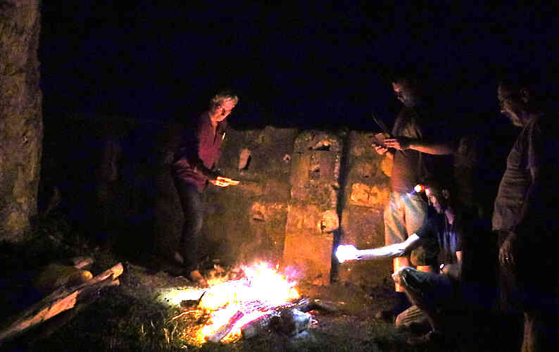 Cooking and fellowship by the light of the fire